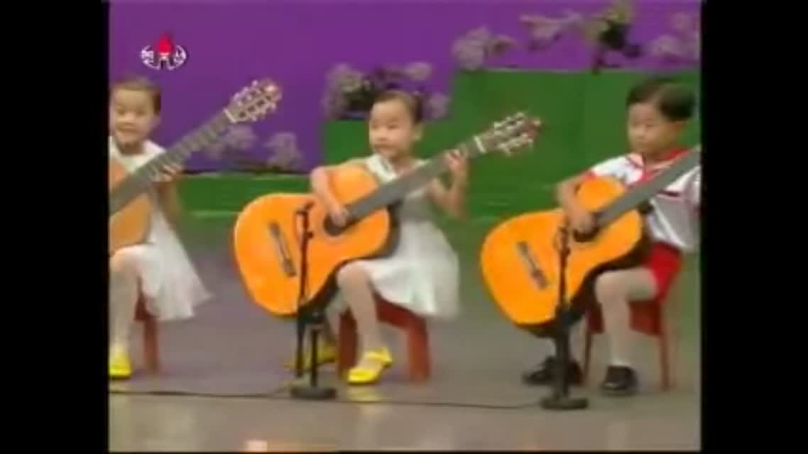 NORTH KOREA CHILDREN PLAYING THE GUITAR
