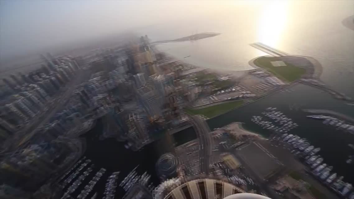 Russian guys on the roof top in Dubai. Princess Tower .414 m